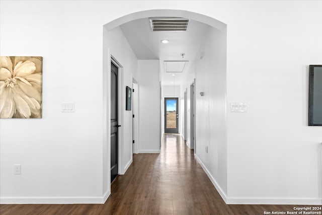 corridor with dark hardwood / wood-style floors