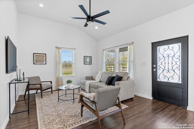 living room featuring dark hardwood / wood-style flooring, plenty of natural light, lofted ceiling, and ceiling fan