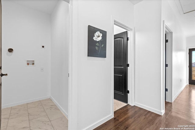 corridor with light wood-type flooring