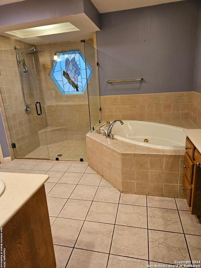 bathroom with vanity, tile patterned floors, and separate shower and tub