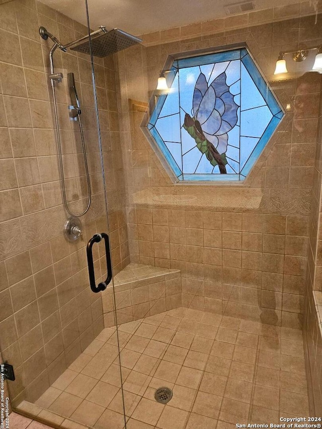 bathroom featuring an enclosed shower