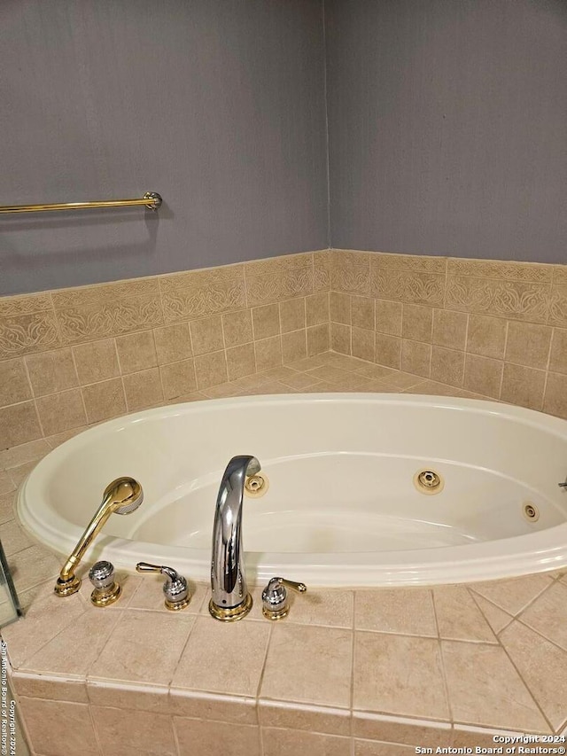 bathroom featuring tiled bath