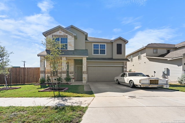 view of front of property featuring a garage and a front yard