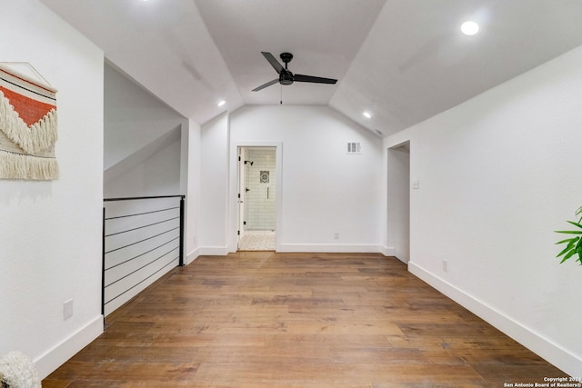 interior space featuring ceiling fan, hardwood / wood-style floors, and lofted ceiling