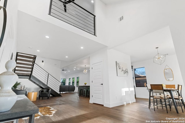 interior space featuring dark hardwood / wood-style floors and a notable chandelier