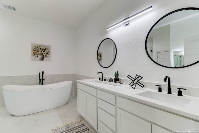 bathroom with a bathtub and vanity