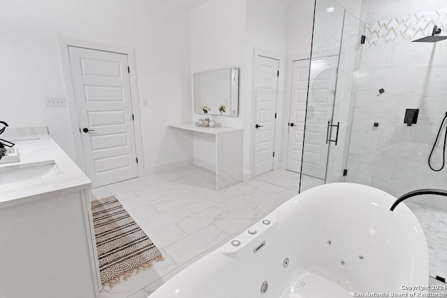 bathroom featuring shower with separate bathtub and vanity