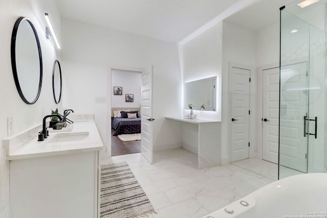 bathroom with vanity and a shower with door