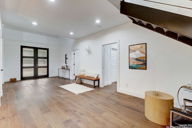 entryway with hardwood / wood-style floors