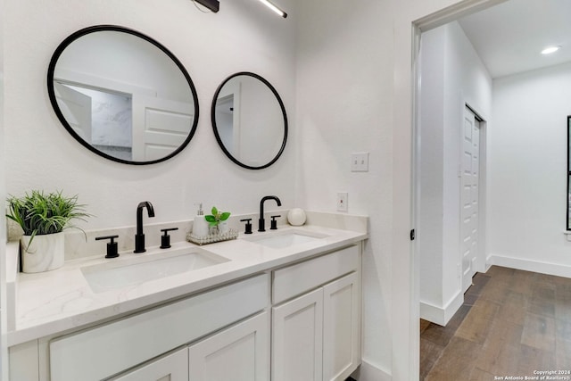 bathroom featuring hardwood / wood-style floors and vanity