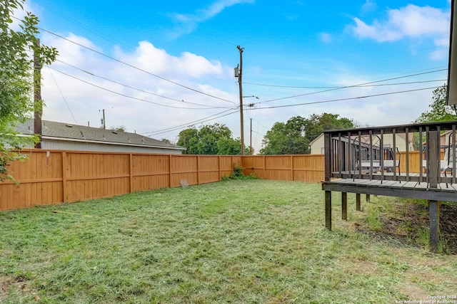 view of yard featuring a wooden deck