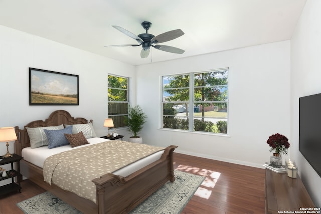 bedroom featuring ceiling fan and dark wood-type flooring