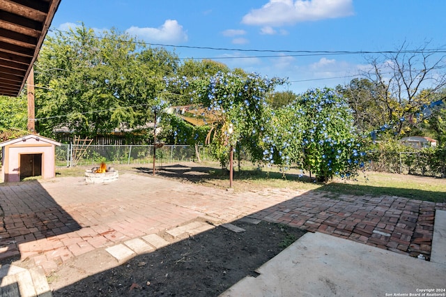 view of patio with a storage shed