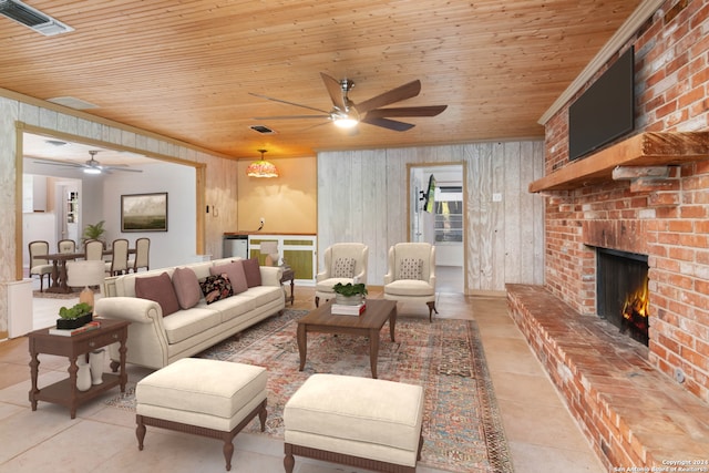 tiled living room featuring wood walls, wooden ceiling, and a fireplace