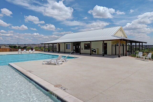 view of swimming pool with a patio