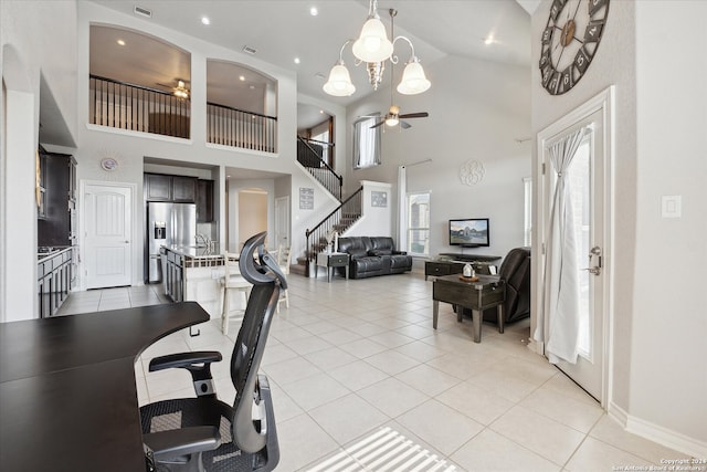 tiled office with ceiling fan and high vaulted ceiling