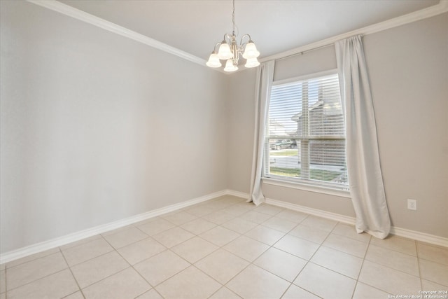 empty room featuring light tile patterned flooring, crown molding, and a chandelier