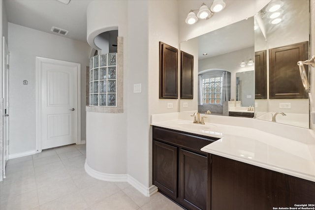 bathroom with tile patterned flooring and vanity