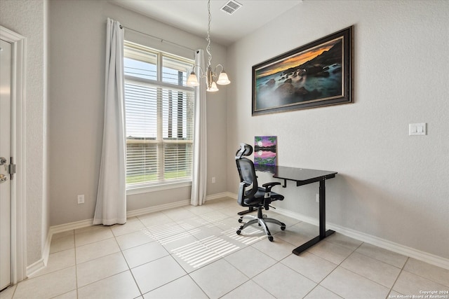 home office featuring plenty of natural light, light tile patterned floors, and a chandelier