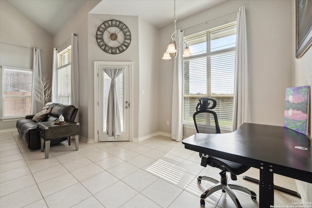 tiled home office featuring a wealth of natural light, lofted ceiling, and an inviting chandelier