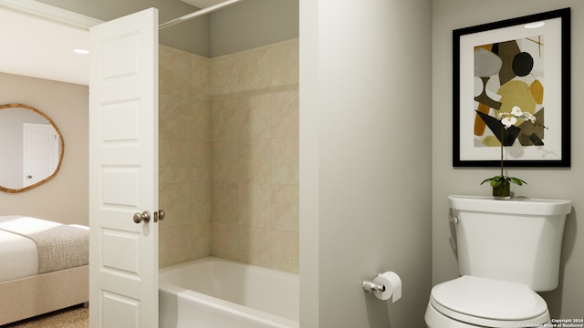 bathroom with toilet and tiled shower / bath