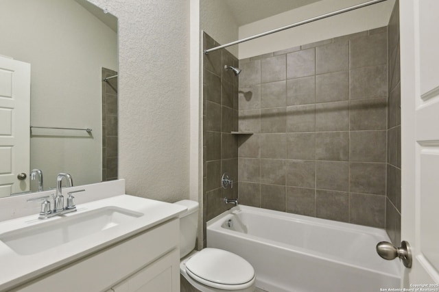 full bathroom featuring vanity, toilet, and tiled shower / bath combo