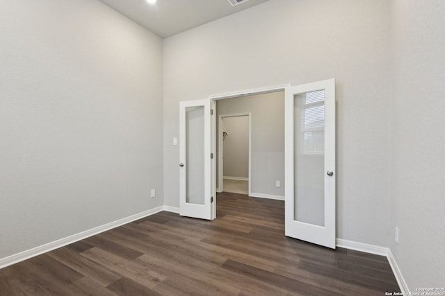 unfurnished room featuring dark hardwood / wood-style floors