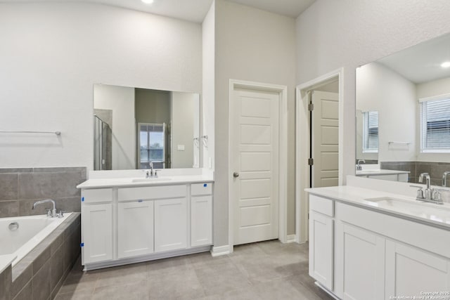 bathroom featuring vanity, tile patterned floors, and independent shower and bath