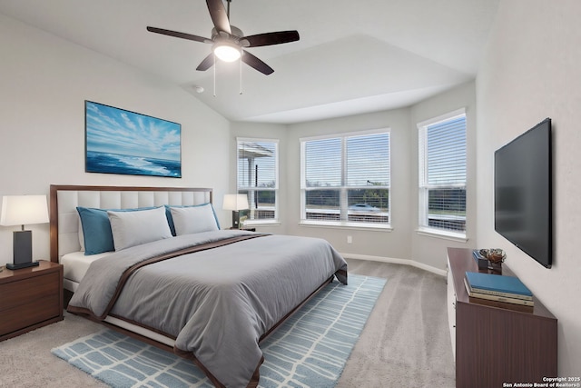 carpeted bedroom with ceiling fan and lofted ceiling