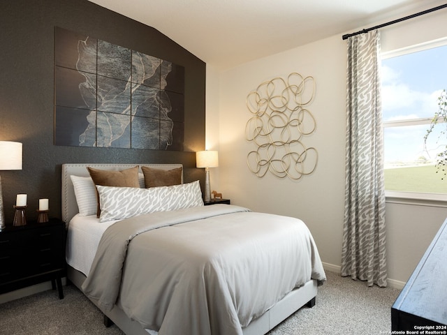 carpeted bedroom featuring vaulted ceiling