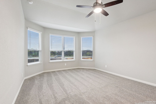 empty room with carpet floors and ceiling fan