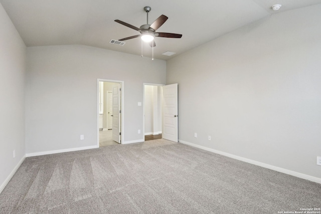 unfurnished bedroom with ceiling fan, ensuite bath, lofted ceiling, and light carpet