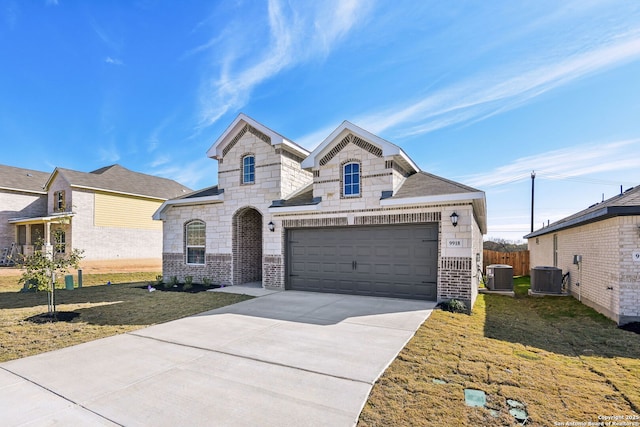 view of front of house featuring central AC and a front lawn