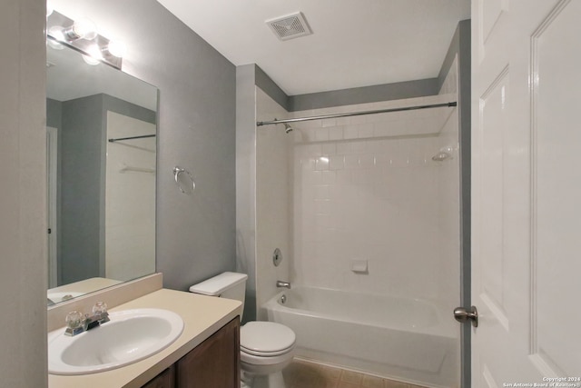 full bathroom with tile patterned flooring, vanity, toilet, and tiled shower / bath