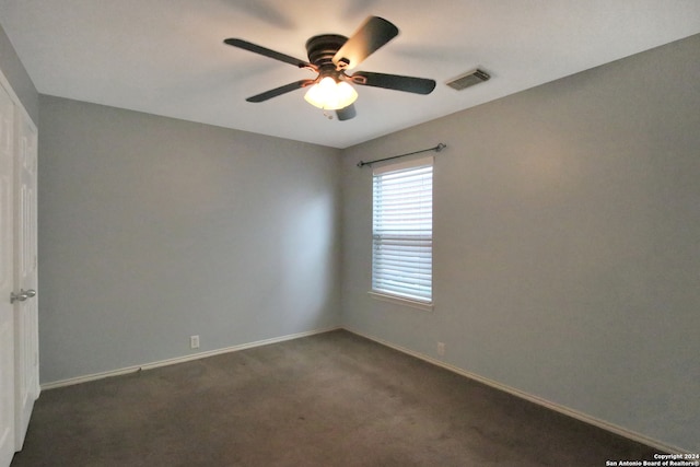 carpeted empty room with ceiling fan