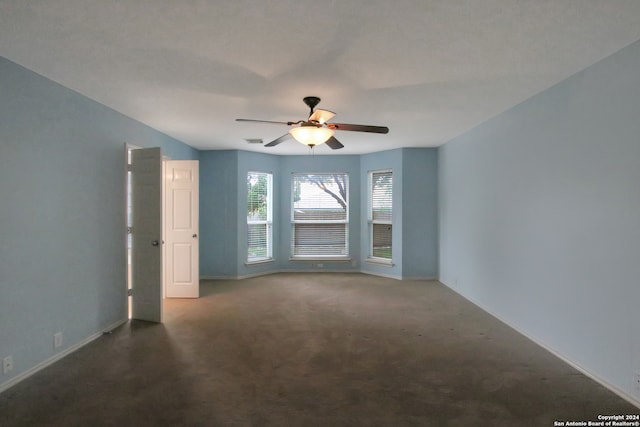 carpeted empty room with ceiling fan