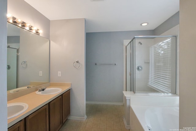 bathroom featuring plus walk in shower and vanity