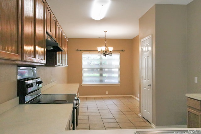 kitchen featuring stainless steel electric stove, light tile patterned floors, decorative light fixtures, and a notable chandelier