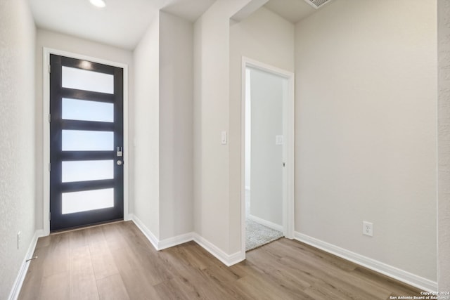 foyer with light hardwood / wood-style floors