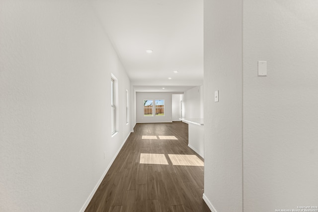 hallway with dark wood-type flooring