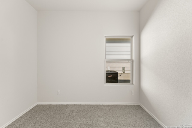 unfurnished room with carpet flooring