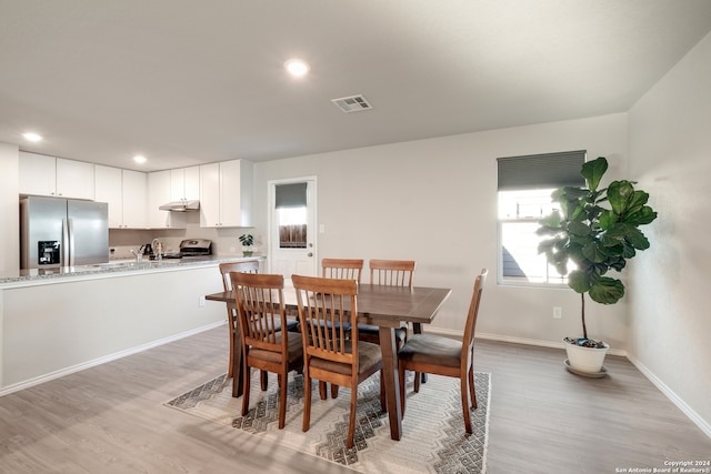 dining area featuring light hardwood / wood-style floors