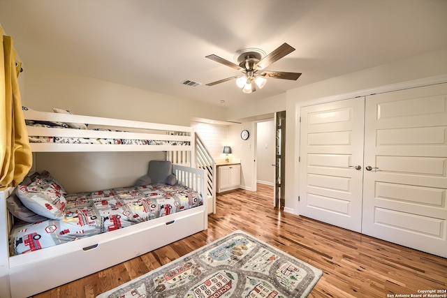 bedroom with ceiling fan, a closet, and light hardwood / wood-style floors