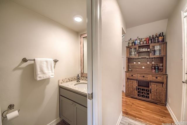 bathroom with wood-type flooring and vanity