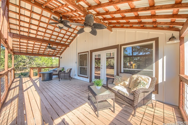 wooden deck with outdoor lounge area and french doors