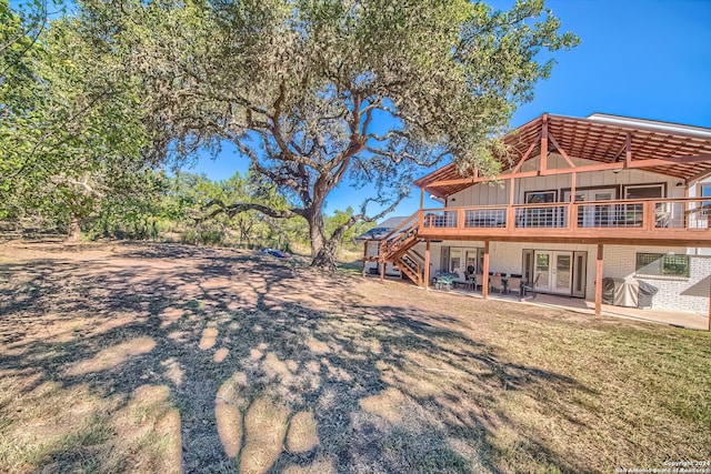 exterior space featuring a deck and a patio