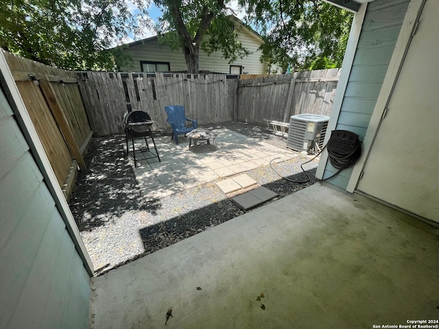 view of patio / terrace with area for grilling and central air condition unit