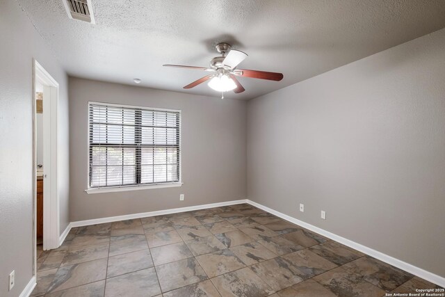4212 Medical Dr Unit 902, San Antonio, TX 78229 - living room featuring a textured ceiling, ceiling fan, and a brick fireplace
