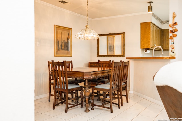 dining area with crown molding, light tile patterned flooring, and a chandelier