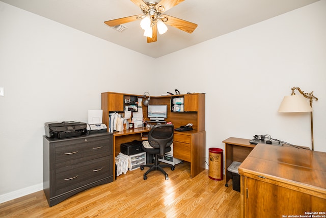 office with ceiling fan and light hardwood / wood-style flooring